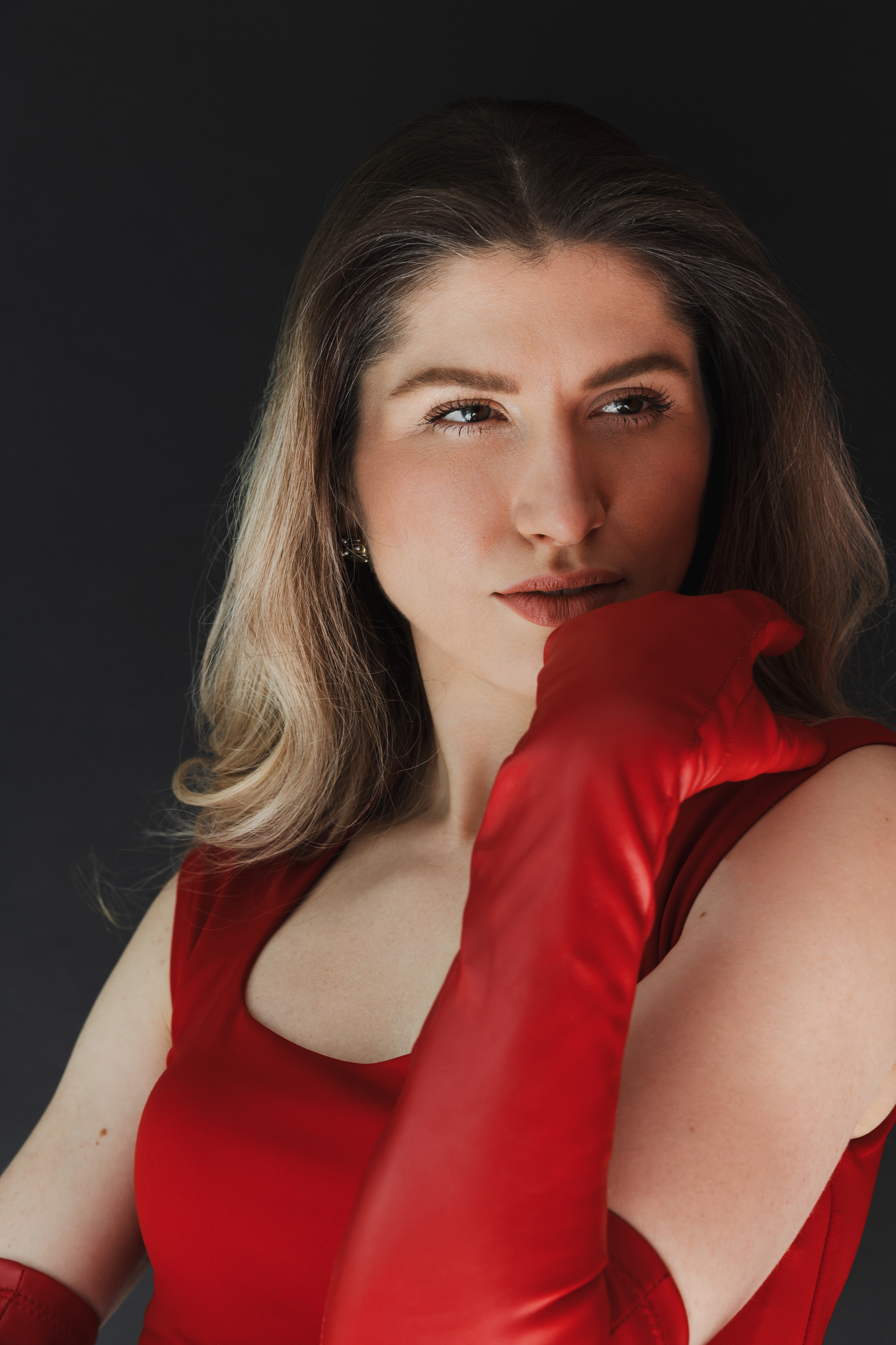 Ilana Kovalle wearing red gloves and a red dress